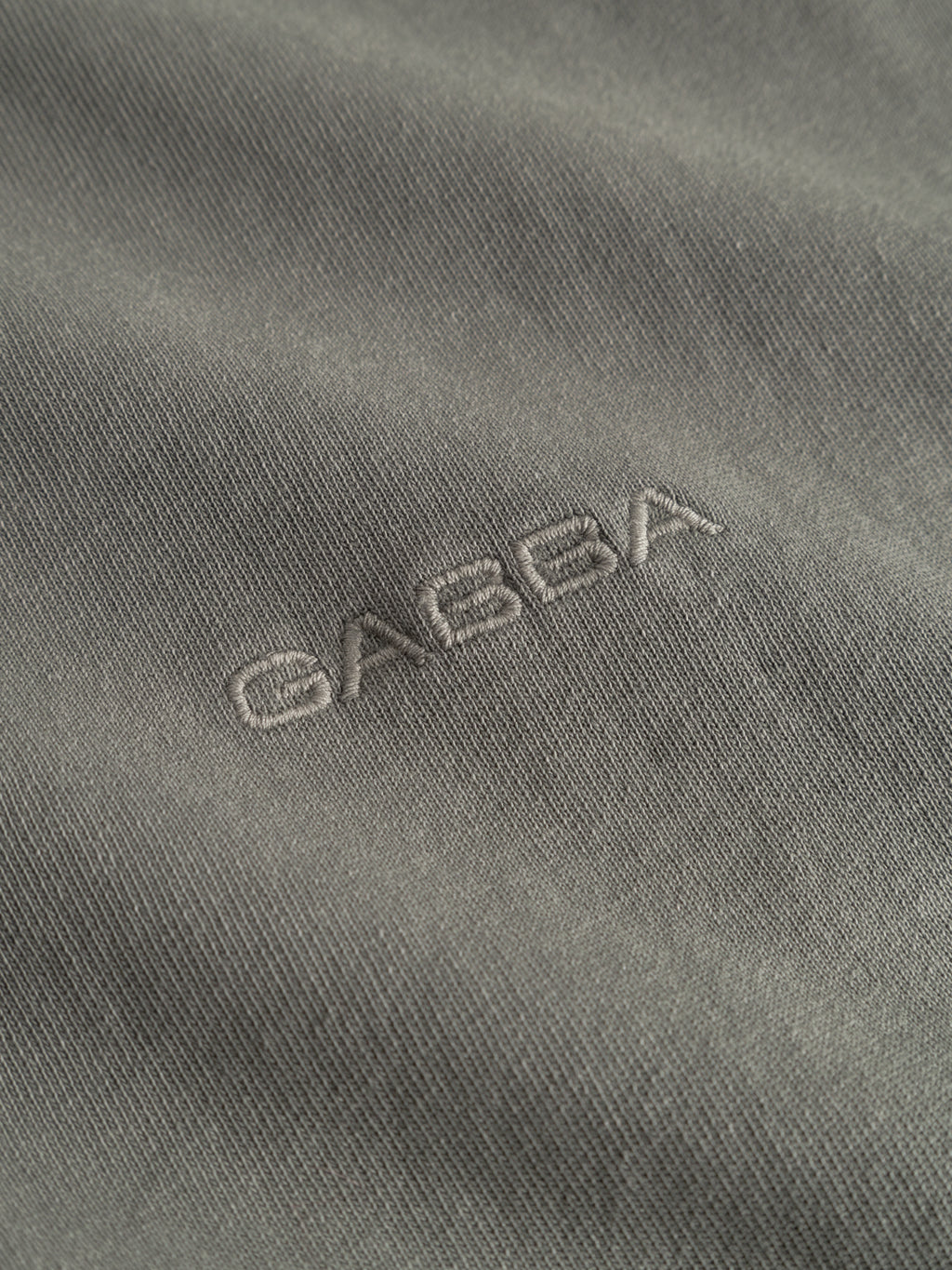 Close-up of heavyweight cotton fabric in Castor Gray from the Gabba GABnigel Wix Boxy Hour SS tee, featuring 
