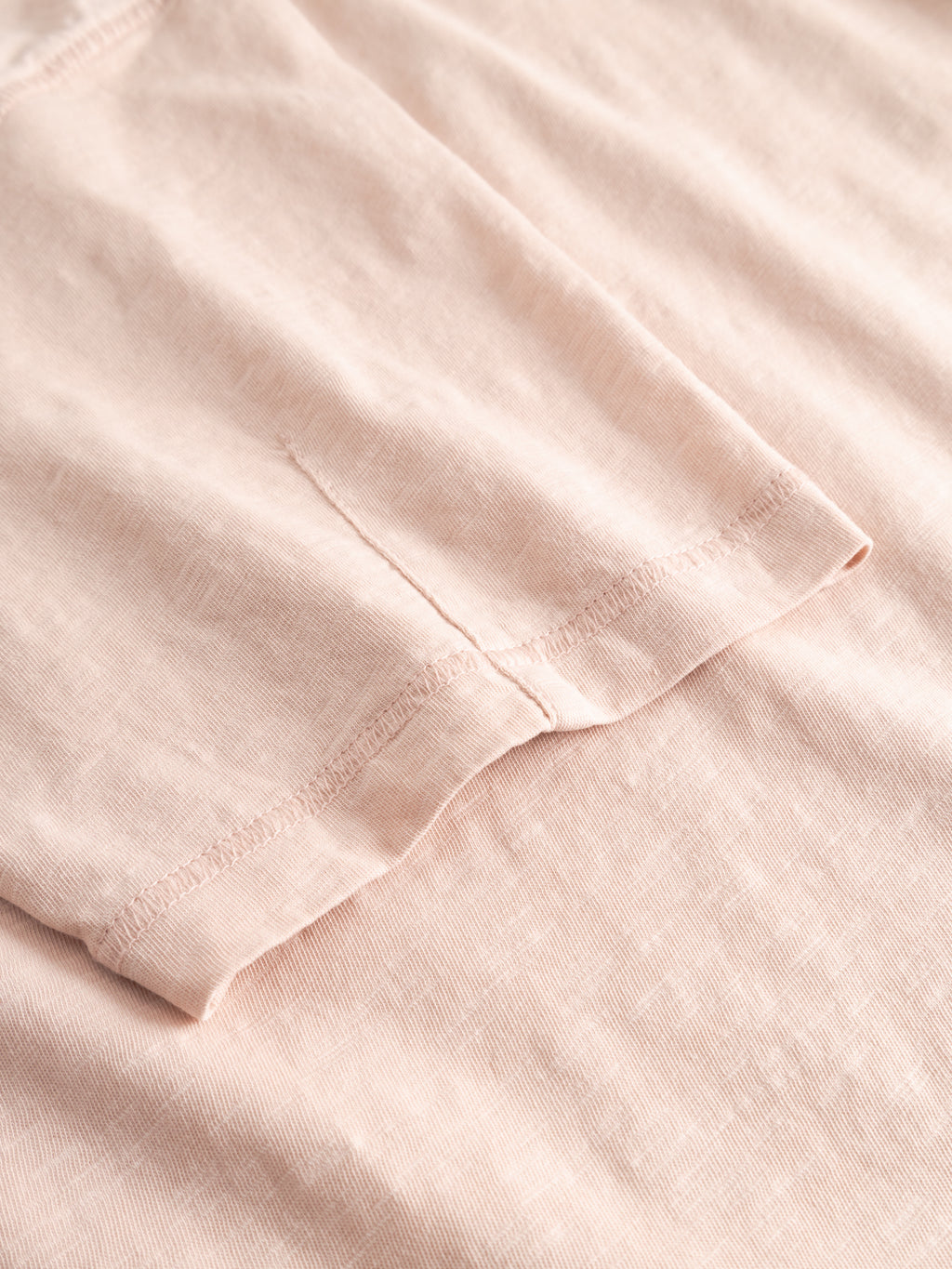 Close-up of the Gabba GABkostant New SS t-shirt in Misty Rose, featuring short sleeves and slub fabric texture with visible stitching, laid flat to showcase detail.