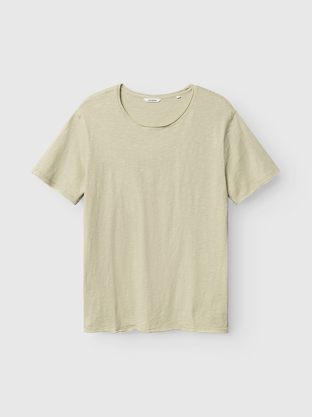 The Gabba GABkostant New SS in Alfa Green is a short-sleeve, crew-neck T-shirt made from 100% cotton textured fabric, shown against a white background.