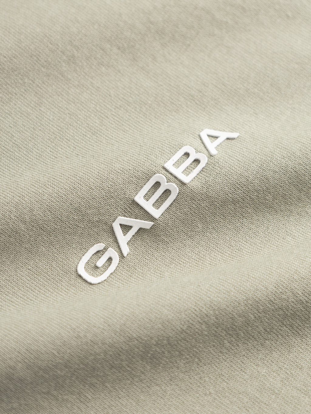 Close-up of light green GABdune Logo GOTS SS T-Shirt by Gabba, featuring 