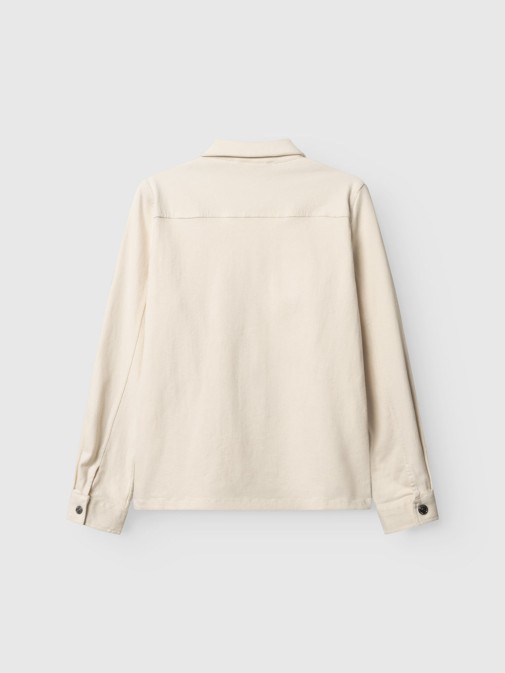 The Gabba GABbeta Twill - Ecru is a cream-toned, long-sleeved overshirt shown from the back, featuring a collar, buttoned cuffs, and a straight yoke across the shoulders.