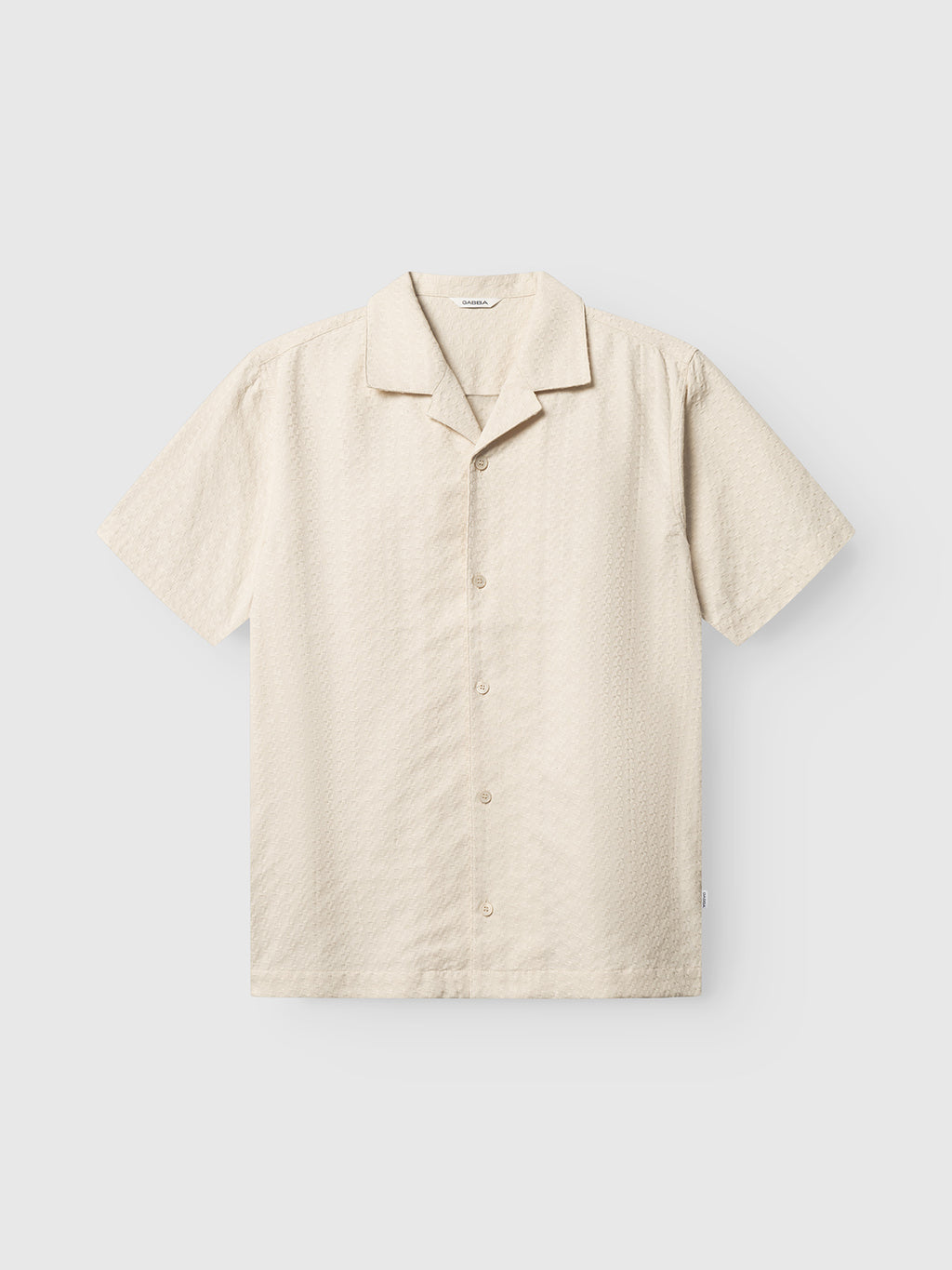 The Gabba GABtimo Resort Neal SS Shirt in Birch is a relaxed-fit, short-sleeve resort shirt with a subtle jacquard 3D motif and notched collar, shown on a plain white background.