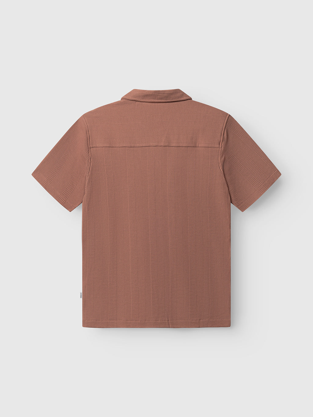 The Gabba GABvalente Wup SS T-Shirt in Wood Pink is shown from the back, highlighting its subtle vertical texture, straight hem, and relaxed fit. Laid flat on a light background to showcase the short sleeves and resort collar design.