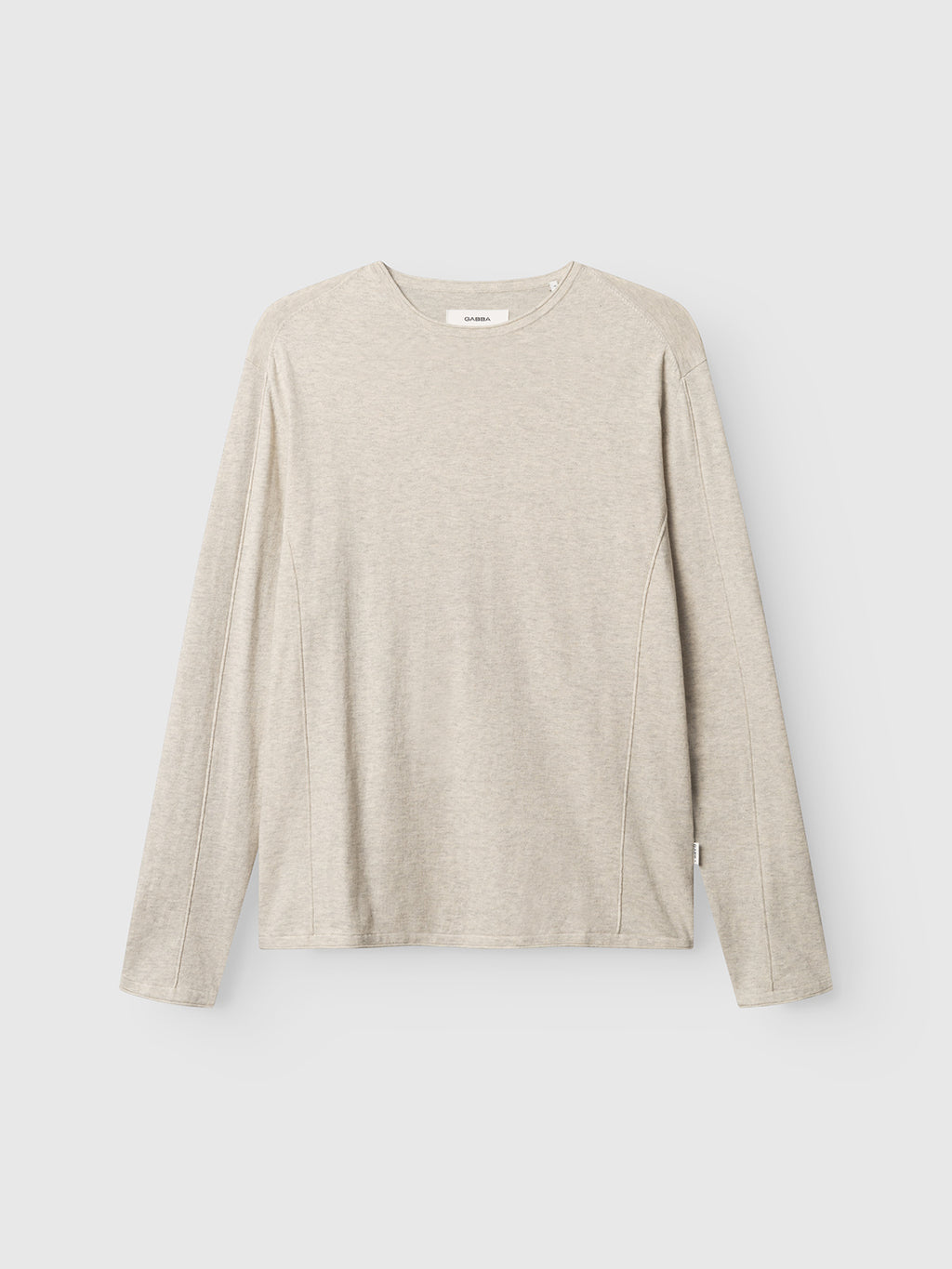 The Gabba GABlima Cot LS Knit - Sand Mel. is a light beige, regular-fit crewneck t-shirt with long sleeves. It features a minimalistic, logo-free cotton knit design and is shown against a plain white background.