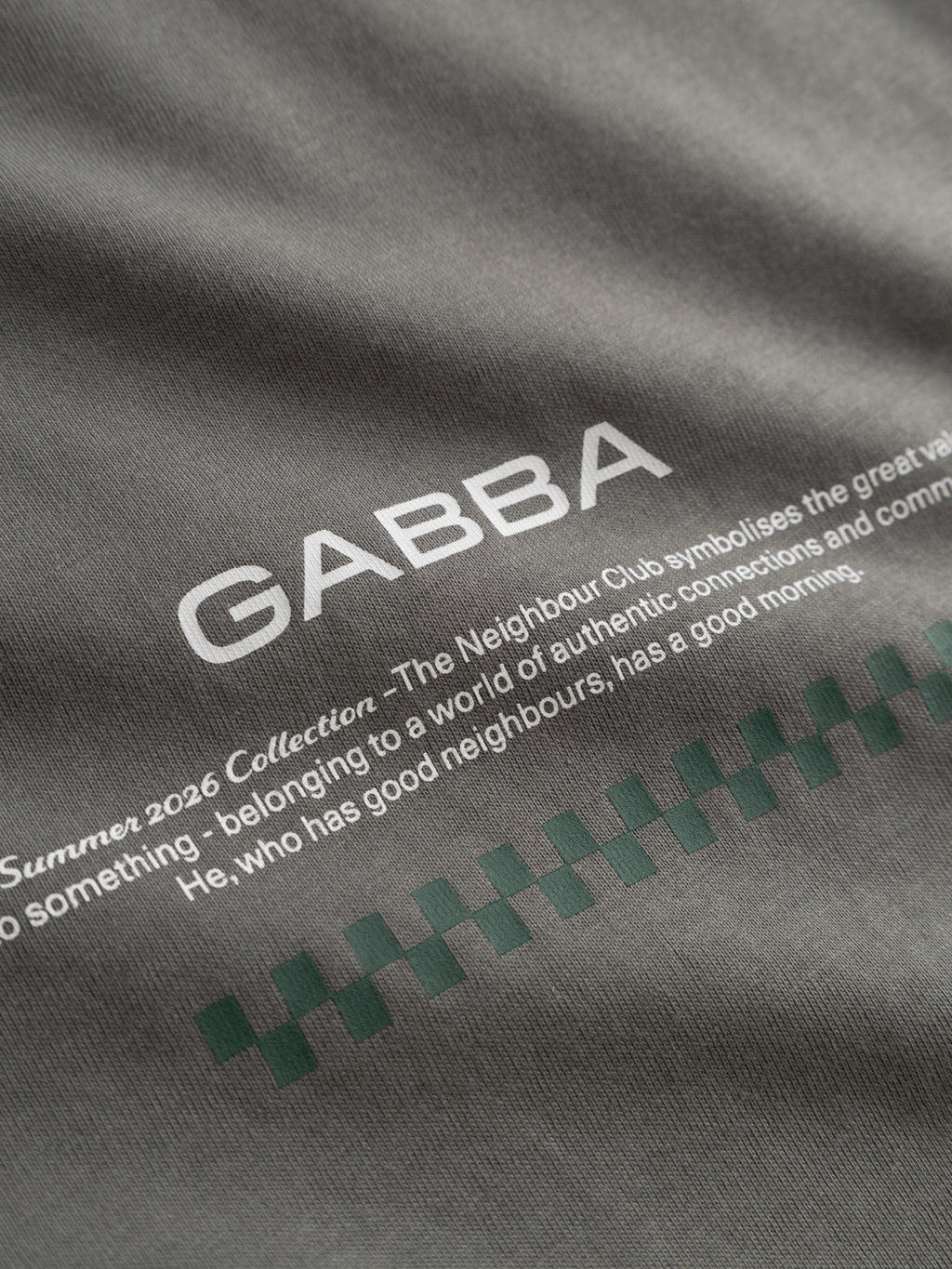 Close-up of the Gabba GABnigel NBH SS T-Shirt GOTS in Castor Gray, featuring white 