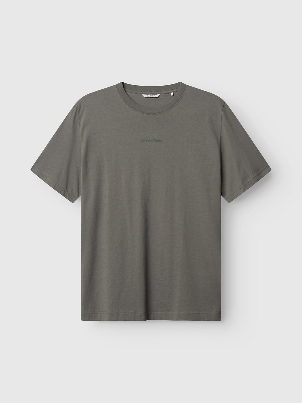 The Gabba GABnigel NBH SS T-Shirt GOTS in Castor Gray is an organic cotton, short-sleeved crewneck tee featuring minimal green chest text, showcased against a light background.
