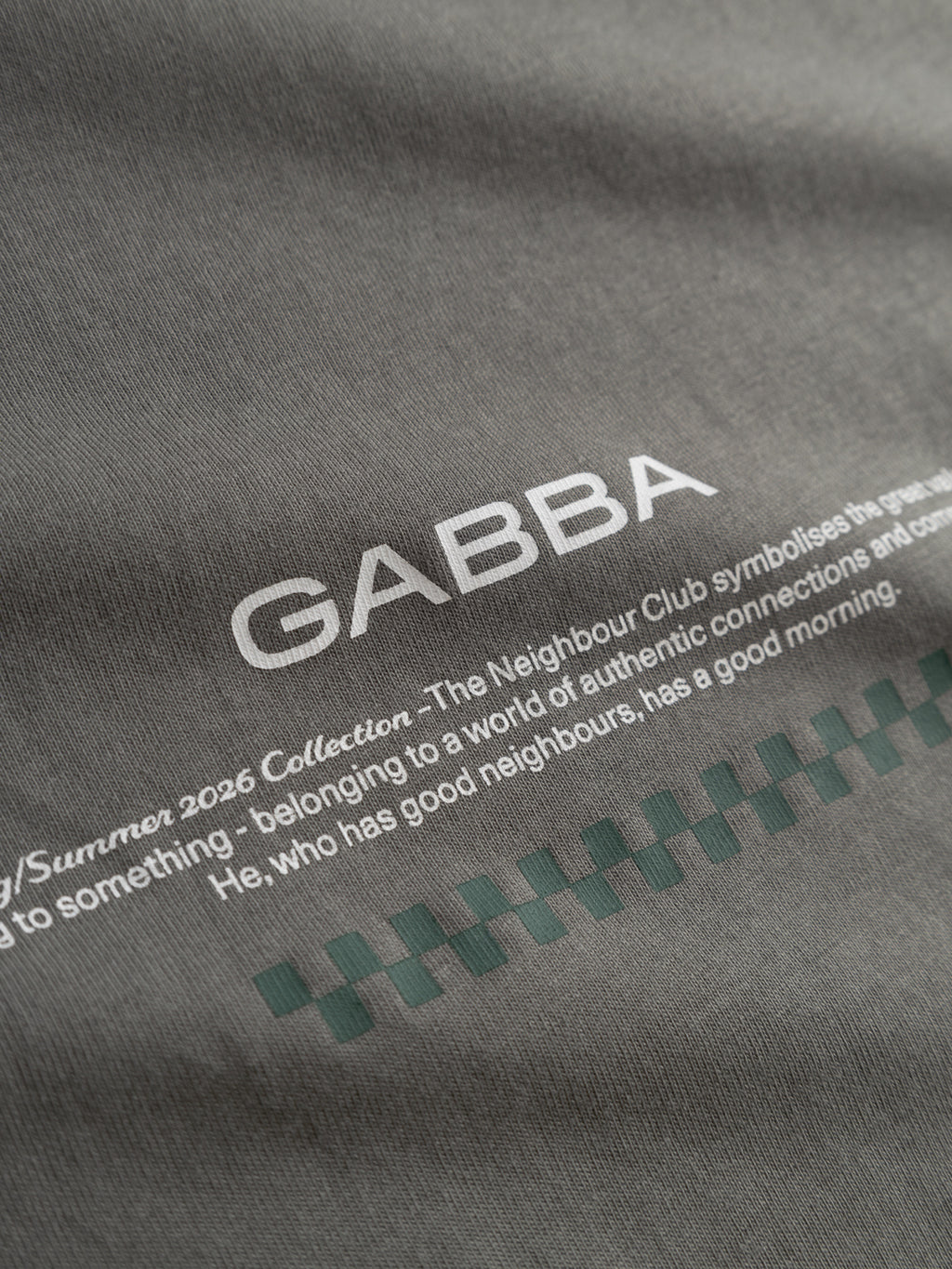 Close-up of the GABnigel Boxy NBH SS T-shirt GOTS in Castor Gray by Gabba—an oversized organic cotton tee with 