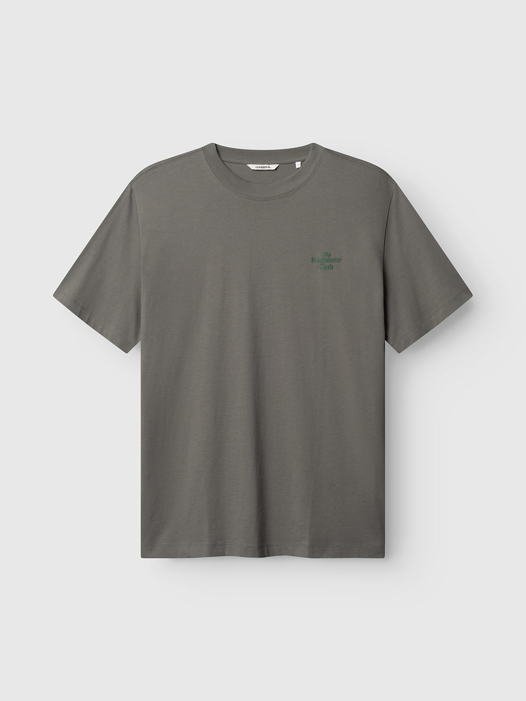 The Gabba GABnigel Boxy NBH SS T-shirt in Castor Gray is an organic cotton, oversized crew neck with short sleeves and a small green logo on the left chest, shown against a light background.