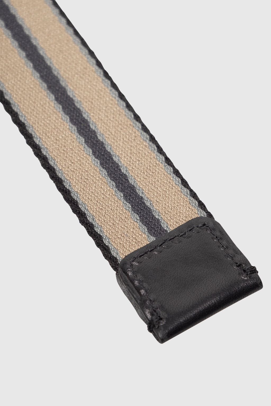 The Gabba GABstromboli Belt - Multi Stripe features beige, black, and gray stripes with leather tips and visible stitching for a modern look.