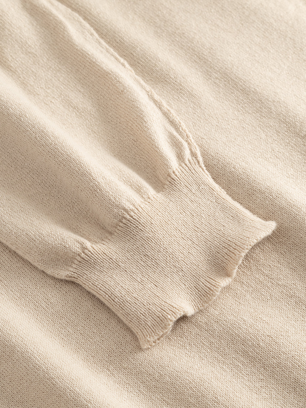 Close-up of the Gabba GABfumo Spy LS Knit in Sand, highlighting the regular fit and ribbed cuff with flat-knit construction and detailed stitching on the sleeve.