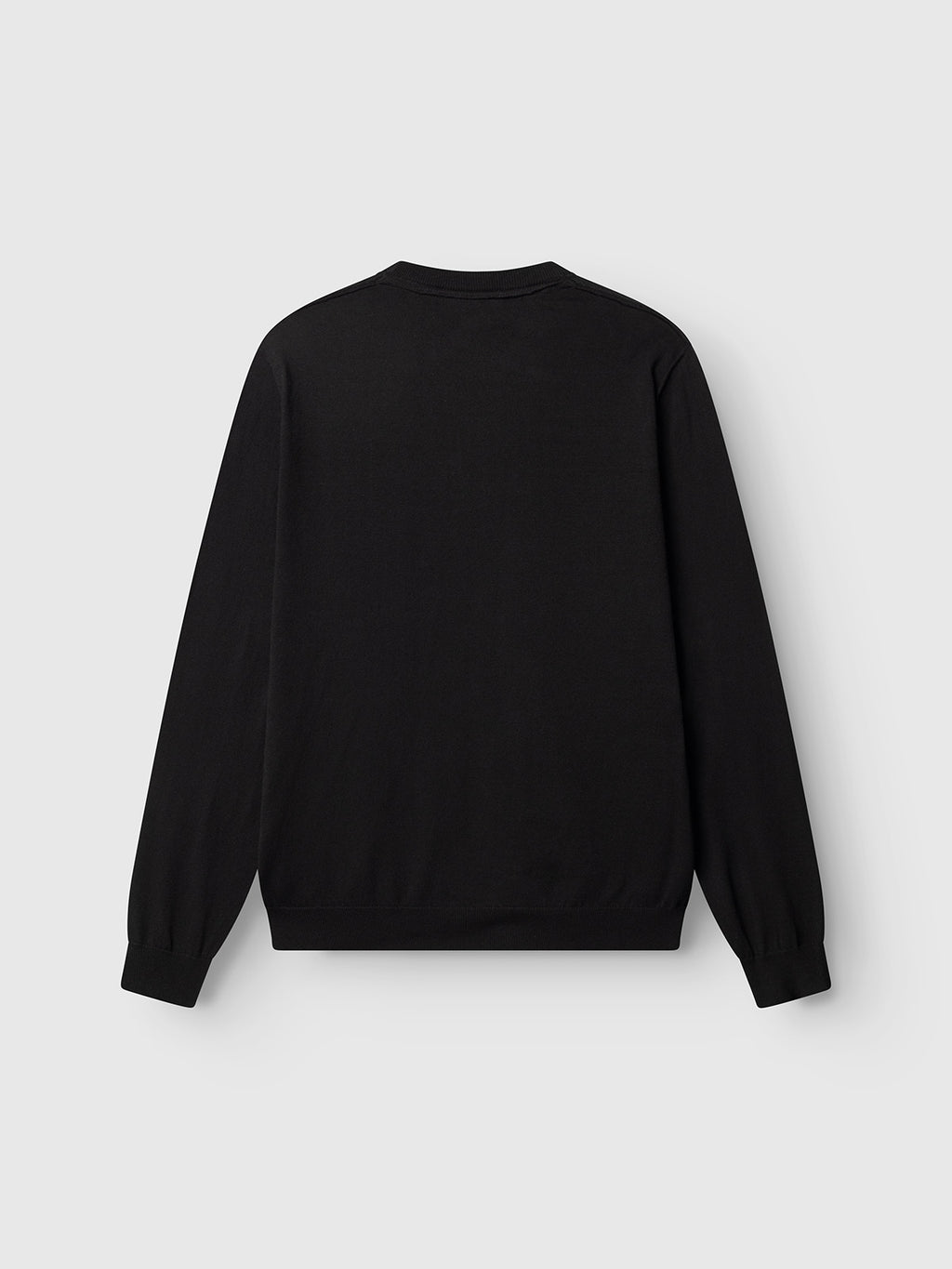 The Gabba GABfumo Spy LS Knit - Black, a regular-fit long-sleeve sweater with a classic design and ribbed cuffs and hem, is shown from the back against a light gray background.