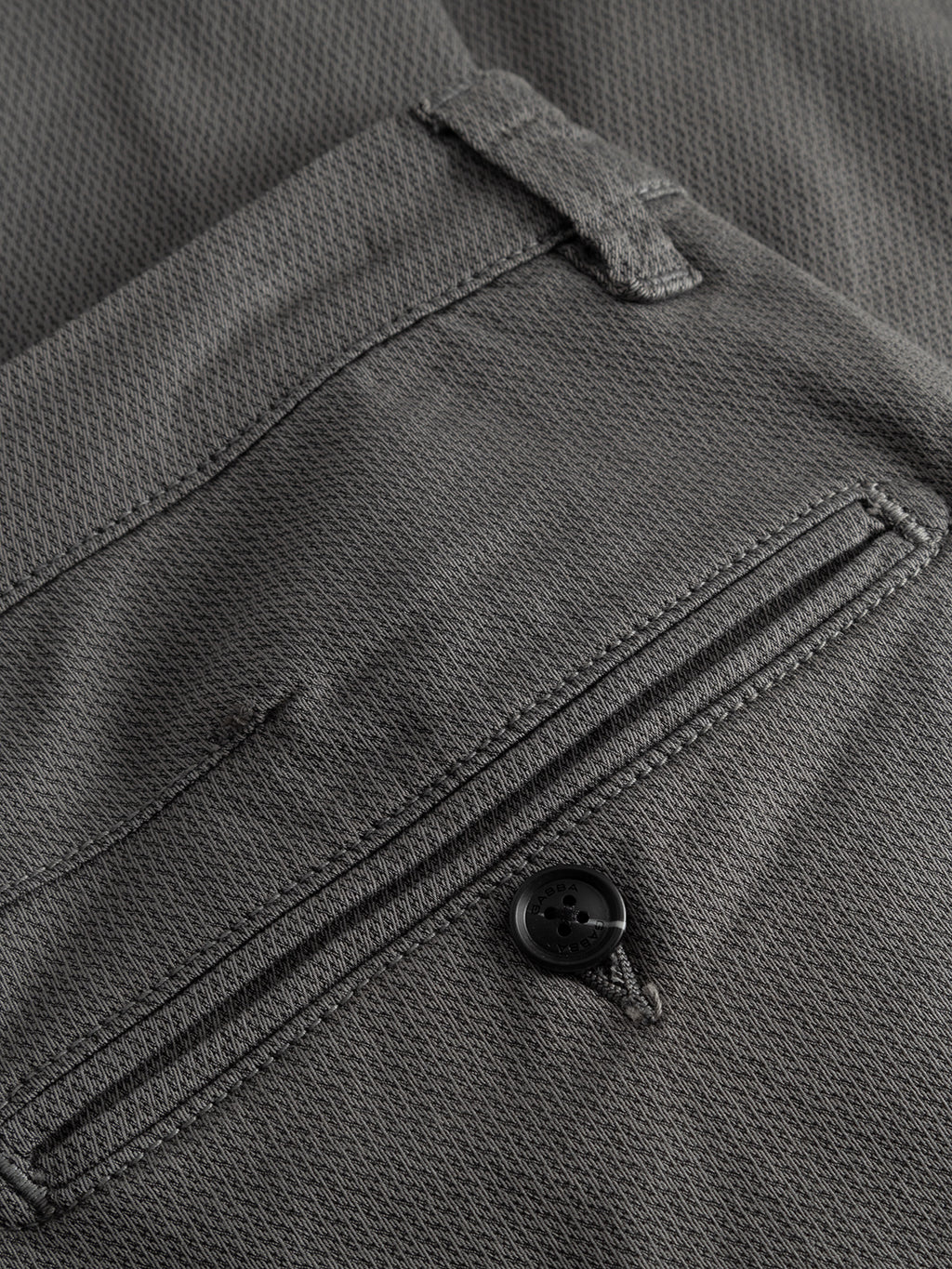 Close-up of the back pocket on the Gabba GABpaul K3280 Dale Chino in Dust Sage Green, showing button closure, visible stitching, and a modern slim leg opening.