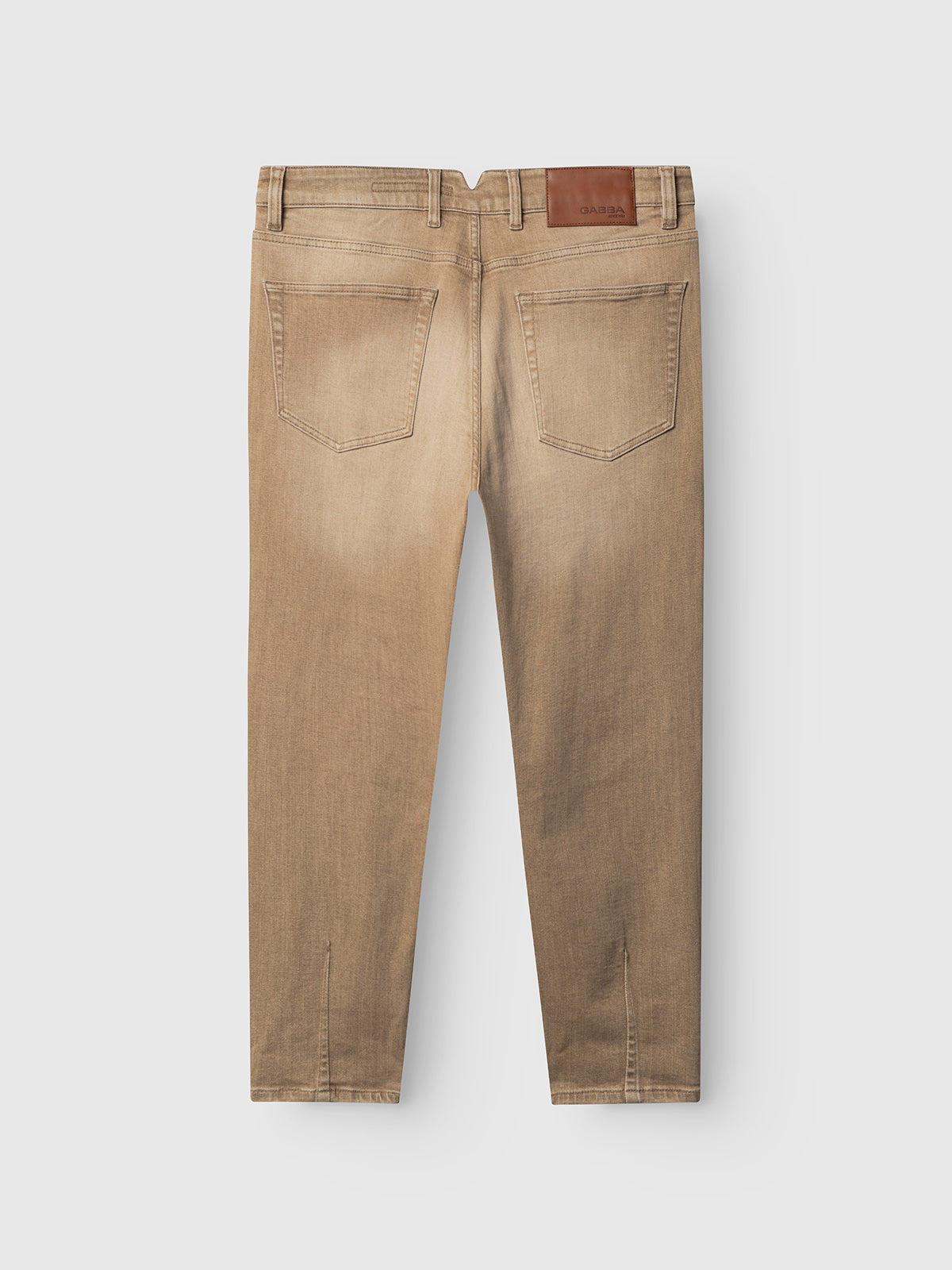 The GABalex Earth - Sand jeans by Gabba are tan, cropped fit, shown from the back with two rear pockets, belt loops, and a brown leather patch on the waistband, set against a plain white background.
