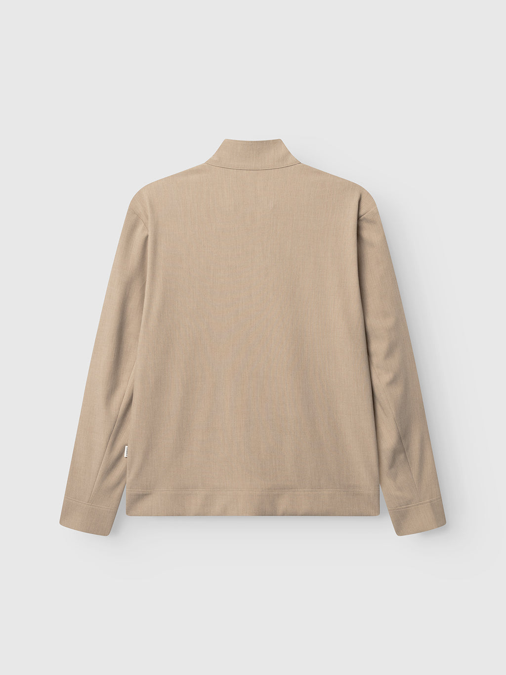 The Gabba GABnik Phin GRS - Sand Plaza is a beige regular-fit jacket with long sleeves, a stand collar, and a straight hem, crafted from recycled polyester and shown laid flat against a light gray background.