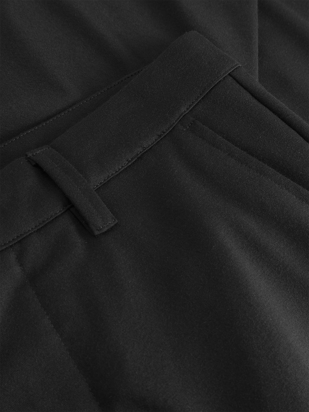 Close-up of Gabba's GABpaul Nygo trousers in black, showing the slim straight fit, soft-touch viscose blend fabric, and details like waistband, belt loops, and stitched pockets for comfort and style.