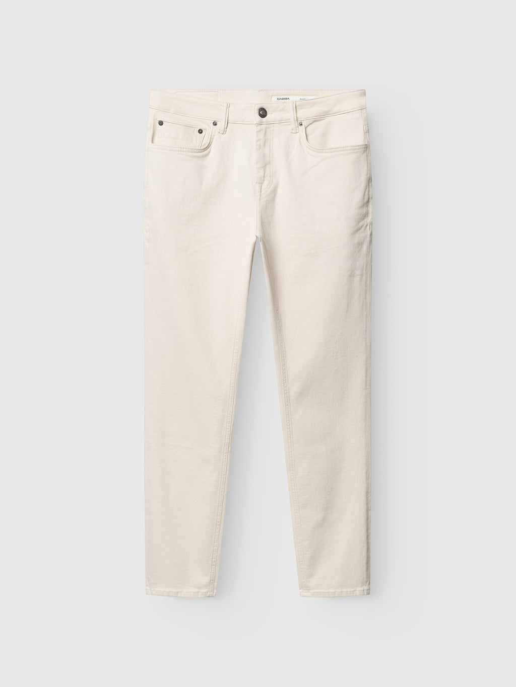 The Gabba GABjones Heski Jeans in ecru are slim-fit, five-pocket jeans with a button closure, crafted from superstretch fabric and shown laid flat on a light gray background.