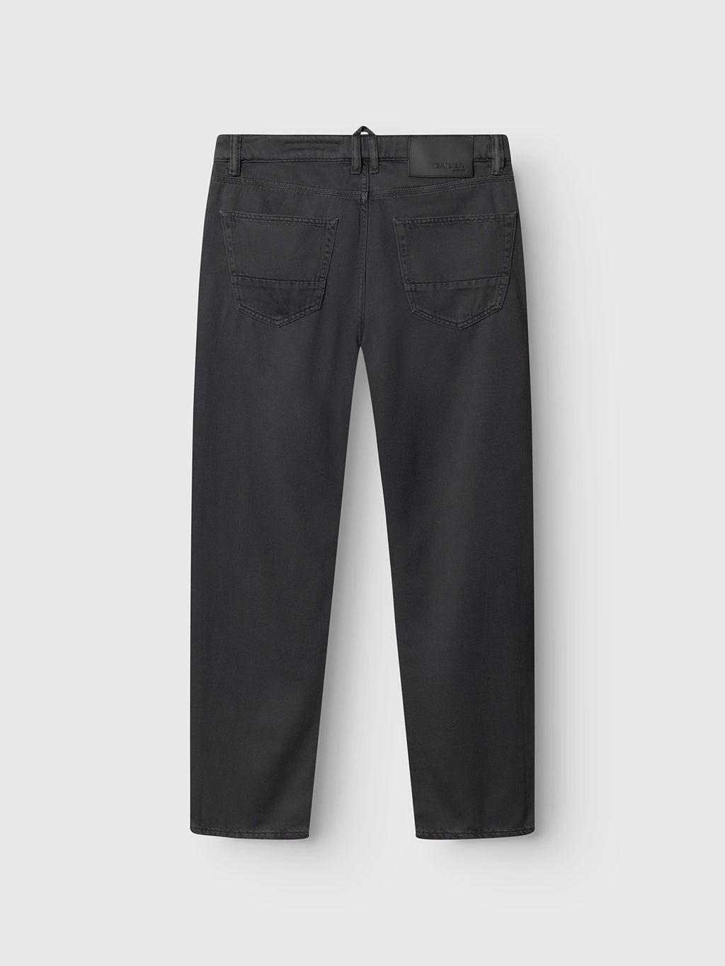 Back view of Gabba GABcarl Blancel TENCEL™ Jeans in black, showing two rear pockets, belt loops, and a black leather waistband patch. Made from a soft TENCEL cotton blend and displayed on a plain white background.