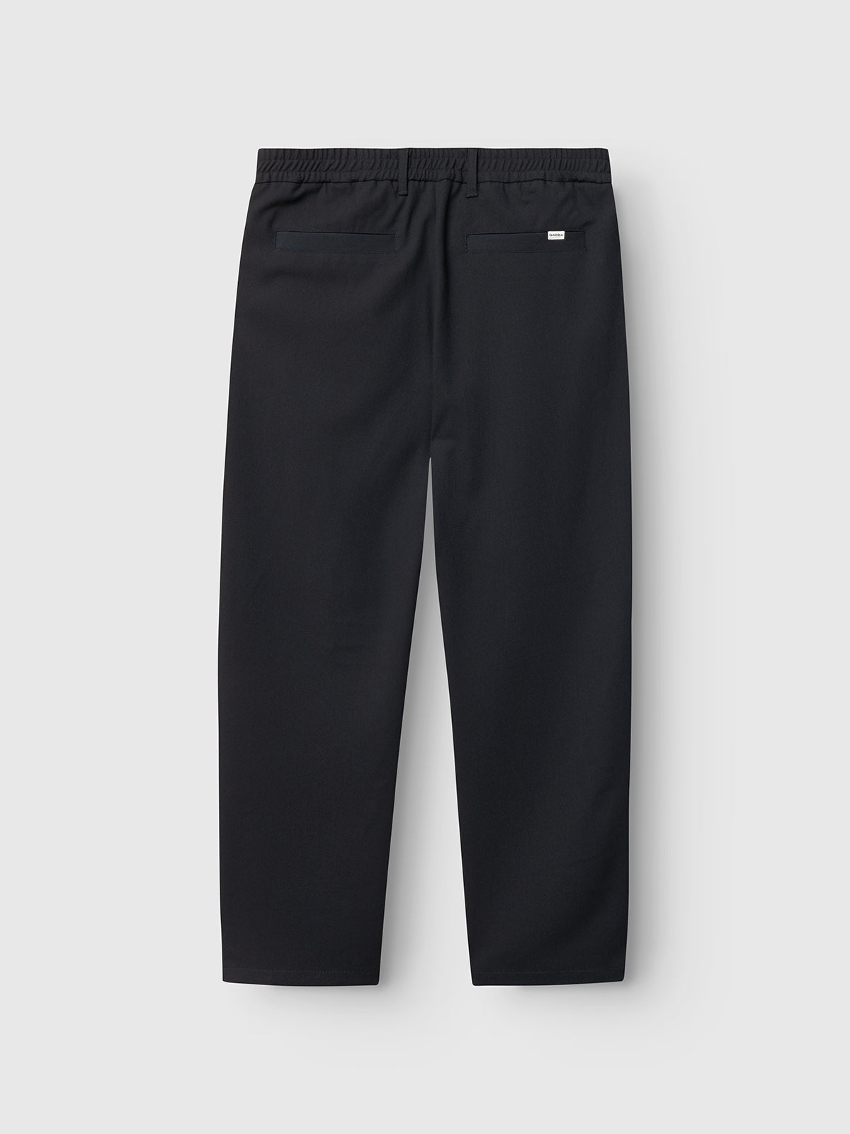 Back view of Gabba GABnapoli 19 Phin GRS - Blue Black chinos in a straight fit wool blend, featuring an elastic waistband, two back welt pockets, and a small white tag above the right pocket on a light gray background.