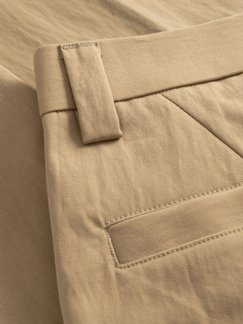 Close-up of the Gabba GABdenver Fuggies Pant in Sand shows a belt loop, side pocket, and textured fabric. Visible stitching and durable material highlight the craftsmanship of these workwear-inspired pants.