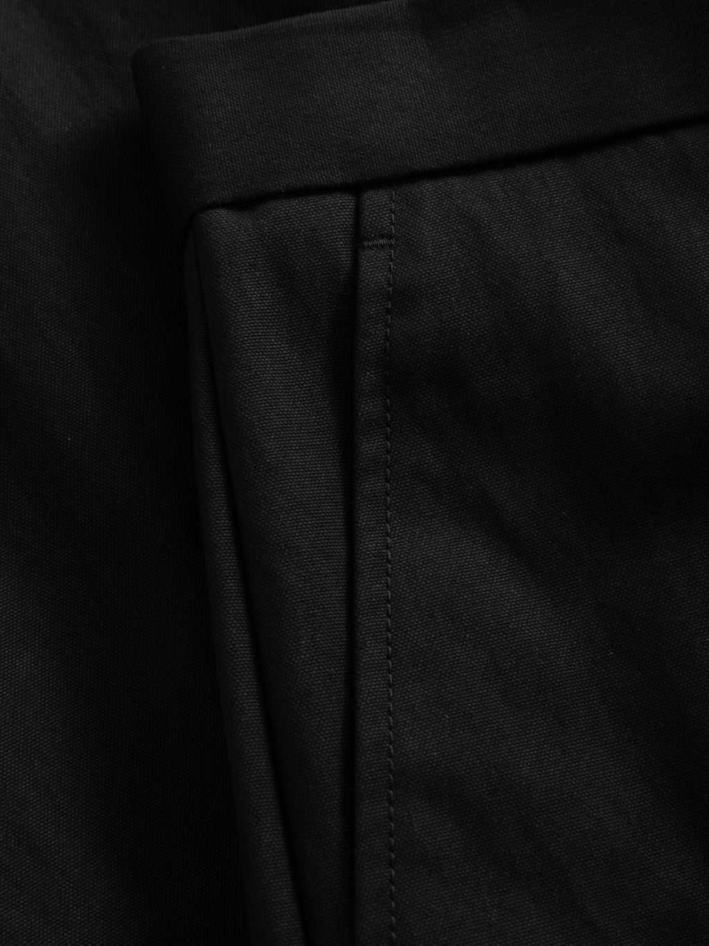 Close-up of the black GABdenver Fuggies Pant by Gabba, featuring durable fabric with a neatly stitched seam and folded edge, highlighting its workwear-inspired design.