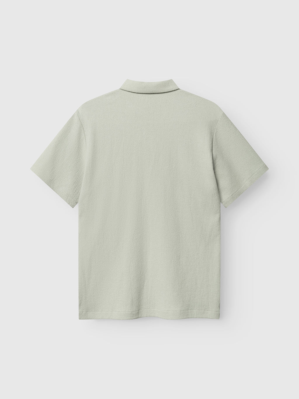 The Gabba GABlio Sku Towel T-Shirt in Mineral Gray is shown from the back, featuring a classic polo collar and plain textured terry cotton fabric, with no visible patterns or logo.