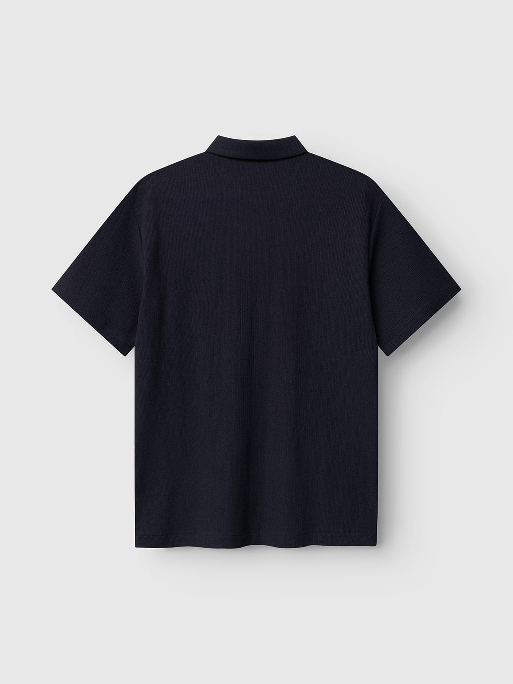 The Gabba GABlio Sku Towel T-Shirt in Night Sky, featuring short sleeves and a classic polo collar, is shown from the back against a light gray background.