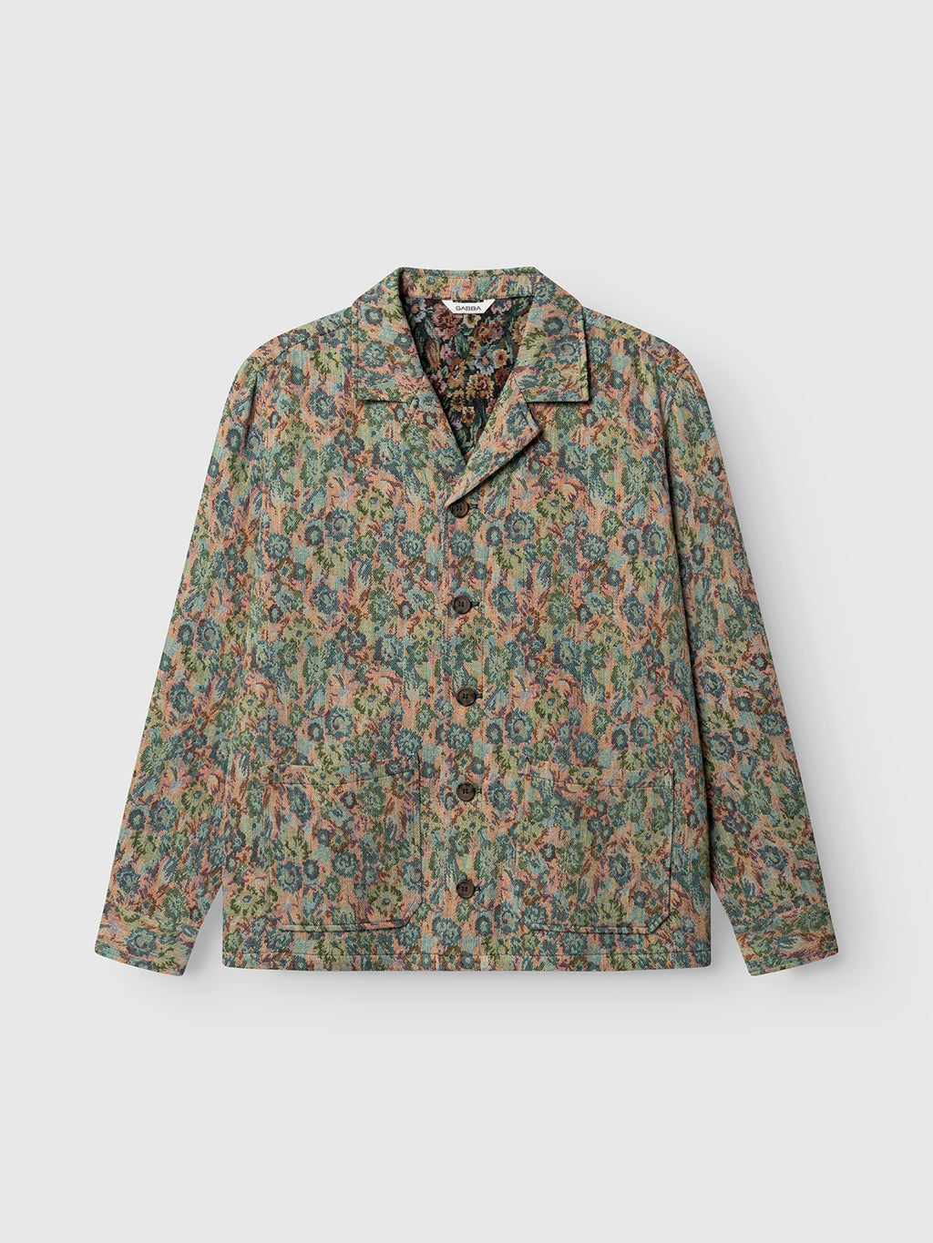 The Gabba GABaustin POKT Kscope LS Overshirt features long sleeves, a wide resort collar, and an abstract multicolored floral pattern on a muted background. This stylish over-shirt jacket is ideal for seasonal layering and is shown laid flat on a light surface.