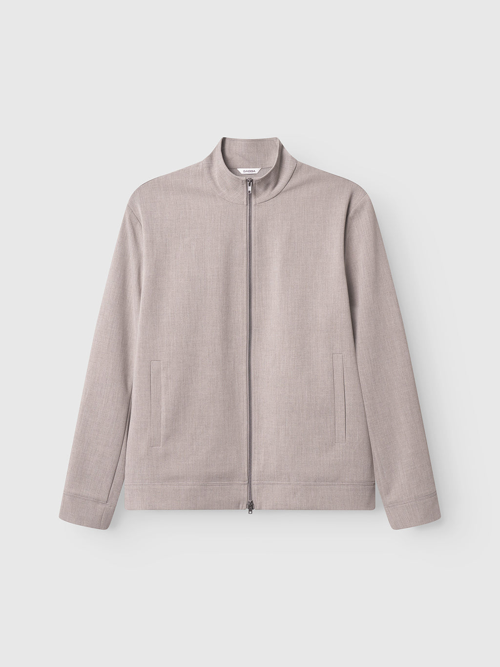 The Gabba GABnik Phin GRS - Sand is a light grey, zip-through jacket with long sleeves, high collar, and two side pockets. Its minimalist design is made from recycled polyester and shown on a plain white background.