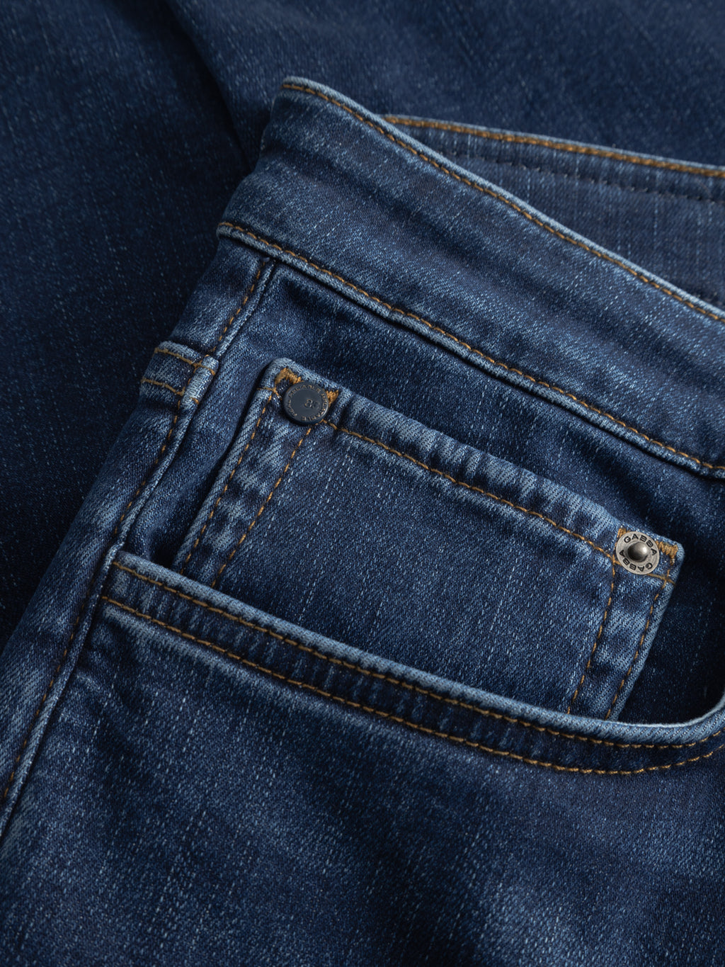 Close-up of the front pocket and small coin pocket on the GABjones Dhera Jeans in mid blue denim by Gabba, highlighting the slim straight fit, stitching details, and metal rivets.