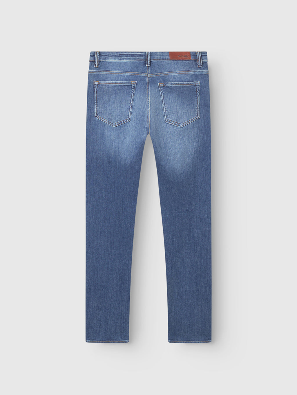 Back view of Gabba GABjones Vanew jeans in mid blue denim, showcasing a slim fit with high flexibility, two back pockets, belt loops, contrast stitching, and a brown leather patch on the waistband.