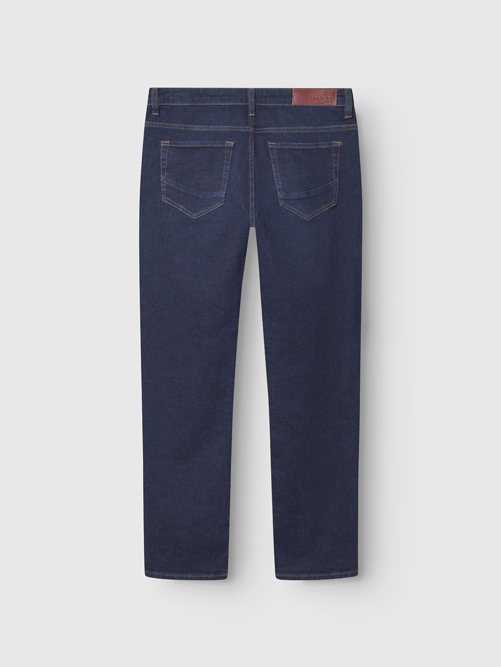 The GABmarc Jingo - Dark Blue Denim by Gabba is a pair of straight fit jeans, shown from the back with two back pockets, belt loops, and a brown leather patch. Crafted from comfort stretch denim for all-day wear.