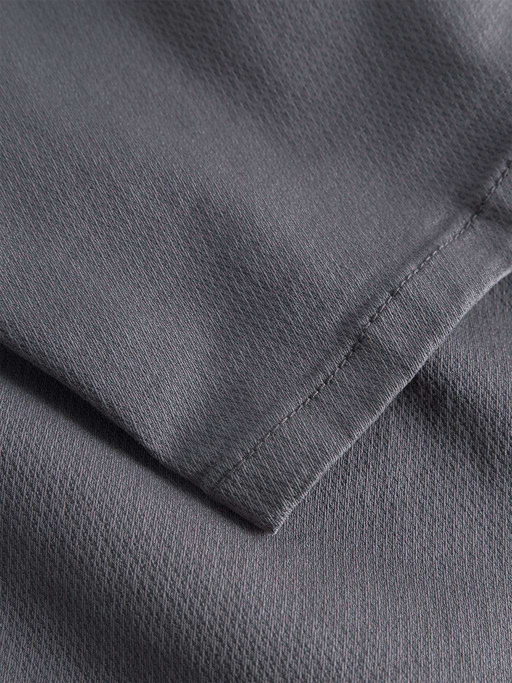 Close-up of the Gabba GABpaul K3280 Dale Chino in Charcoal, showing its slim fit, detailed stitching, and subtle diagonal weave in gray textured fabric.