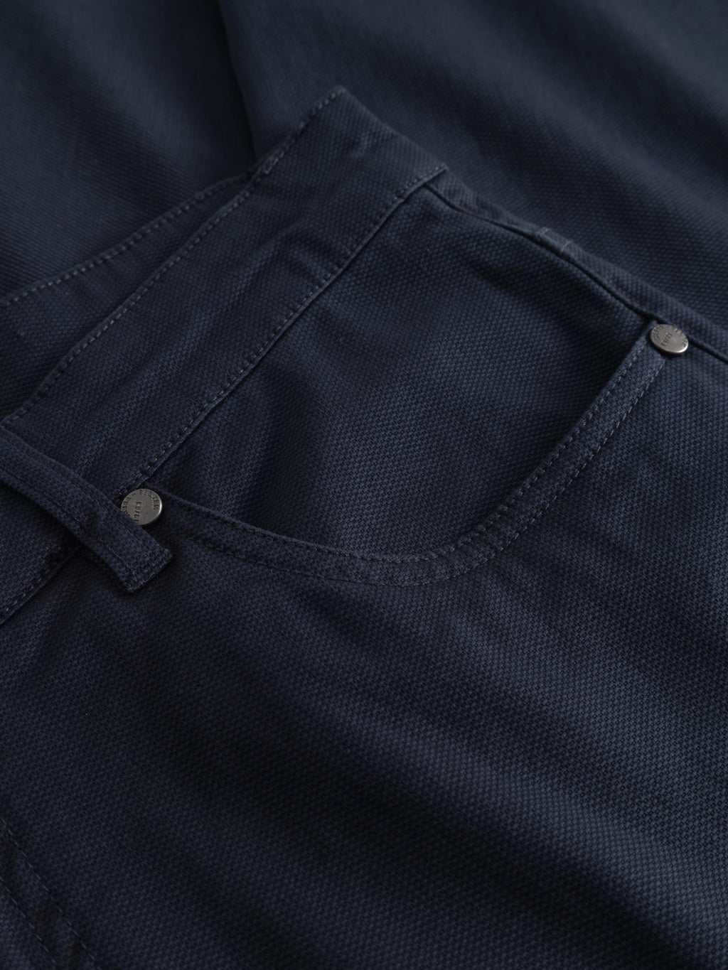 Close-up of the front pocket and waistband on Gabba’s GABmarc 5poc Marlo - Dark Navy jeans, highlighting the textured fabric, stitching, belt loop, and metallic rivets.