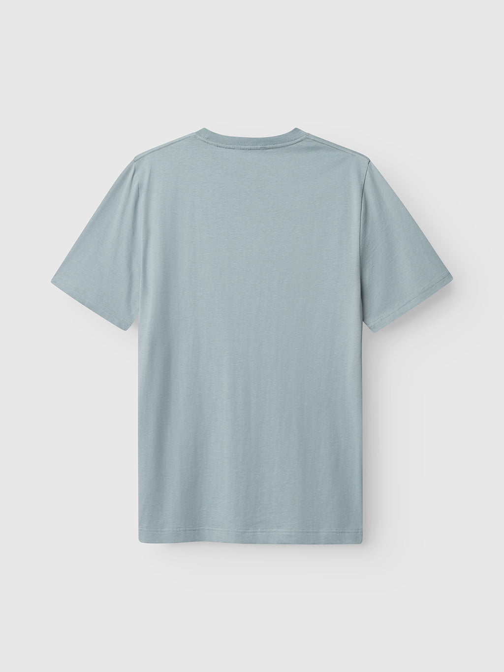 The Gabba GABdune Logo GOTS SS T-Shirt in light blue is shown from the back on a white background, featuring organic cotton material, a classic fit, simple crew neckline, and no visible designs or logos.