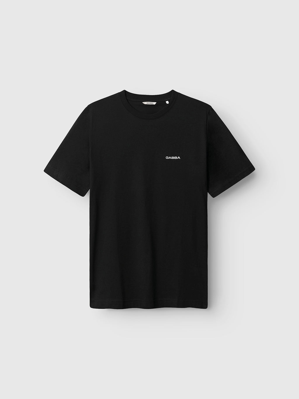 The Gabba GABdune Logo GOTS SS T-Shirt in black features a small white Gabba logo on the left chest and is displayed against a light gray background.
