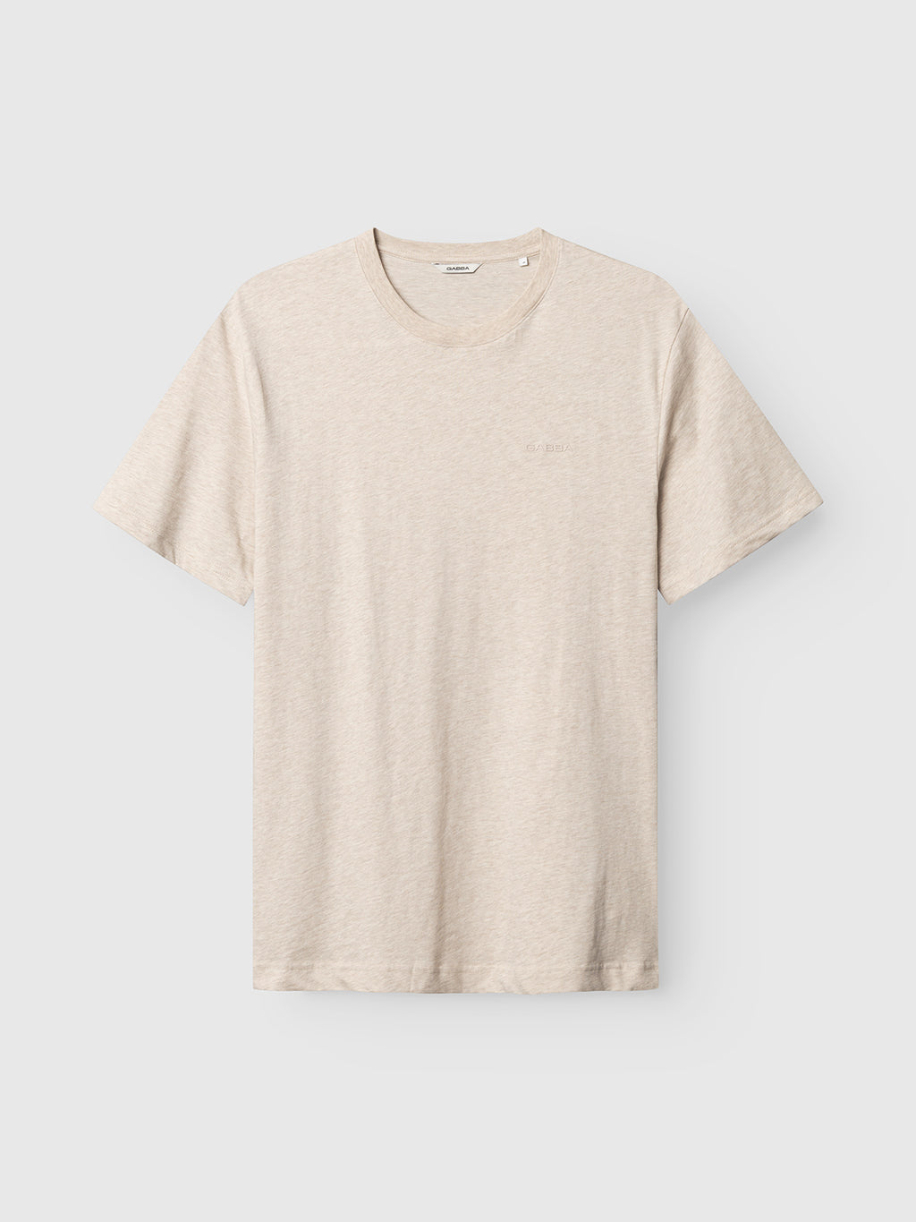 The Gabba GABdune Melange New SS T-Shirt in Sand Mel. is a beige, short-sleeved jersey tee with a crew neck and Gabba chest logo, shown laid flat on light gray. Minimalist design, soft feel, no visible patterns or graphics.