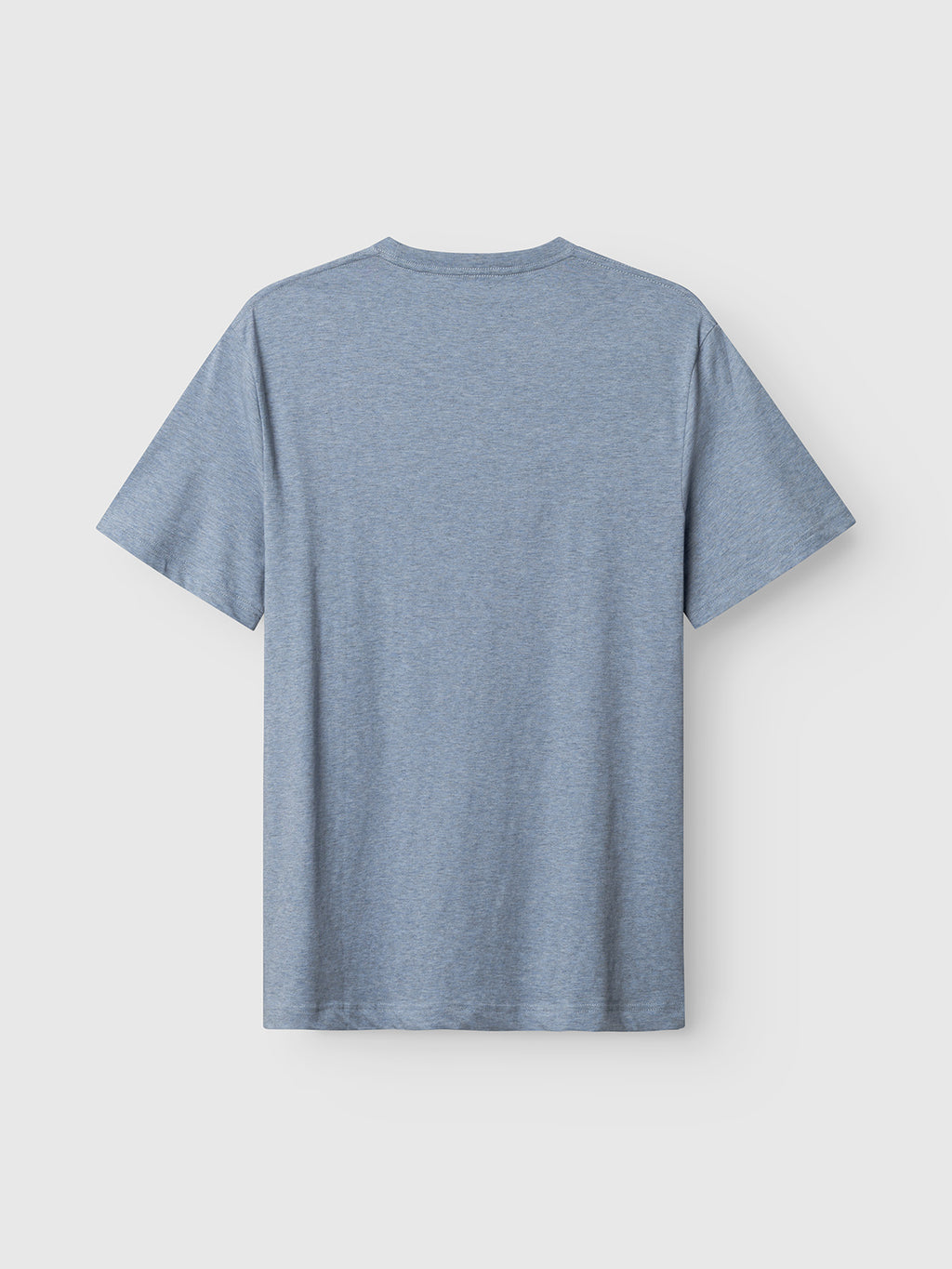 The Gabba GABdune Melange New SS T-Shirt in Blue Melange is displayed flat, back side up, on a light grey background. This short-sleeved jersey offers a soft hand feel.