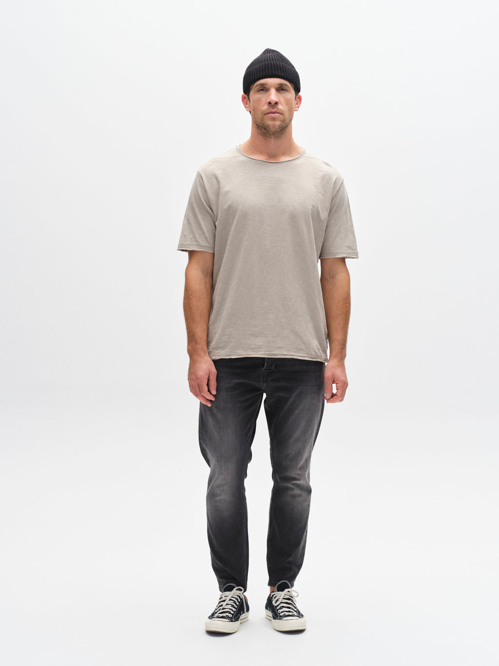 A man wearing the Gabba GABkostant New SS - Grey Paloma t-shirt stands facing forward against a plain white background.