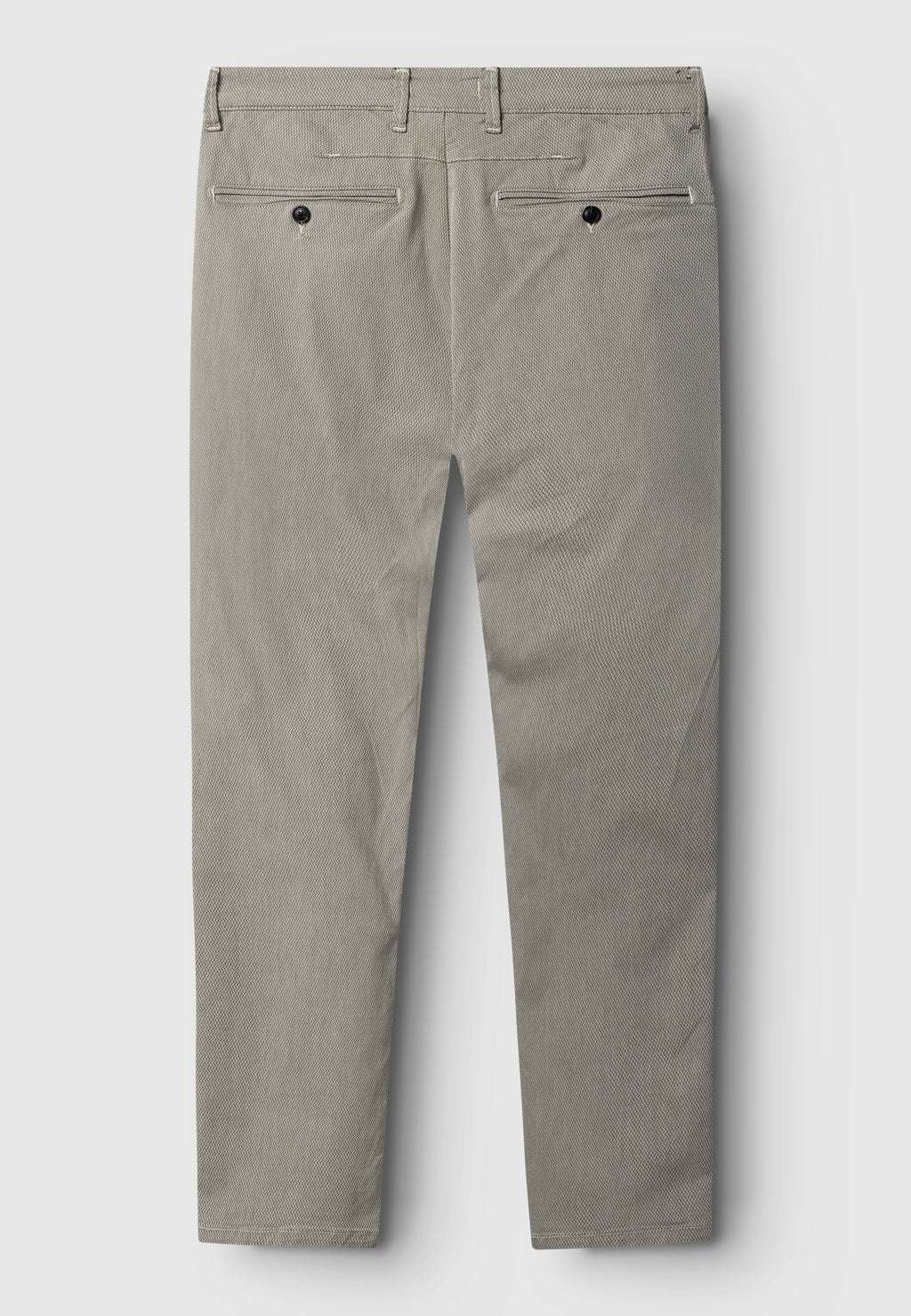 Back view of the Gabba GABpaul K3280 Dale Chino in Birch: slim fit, light gray color, belt loops, double-paspel back pockets with black buttons, French pockets, and a straight-leg tailored design.
