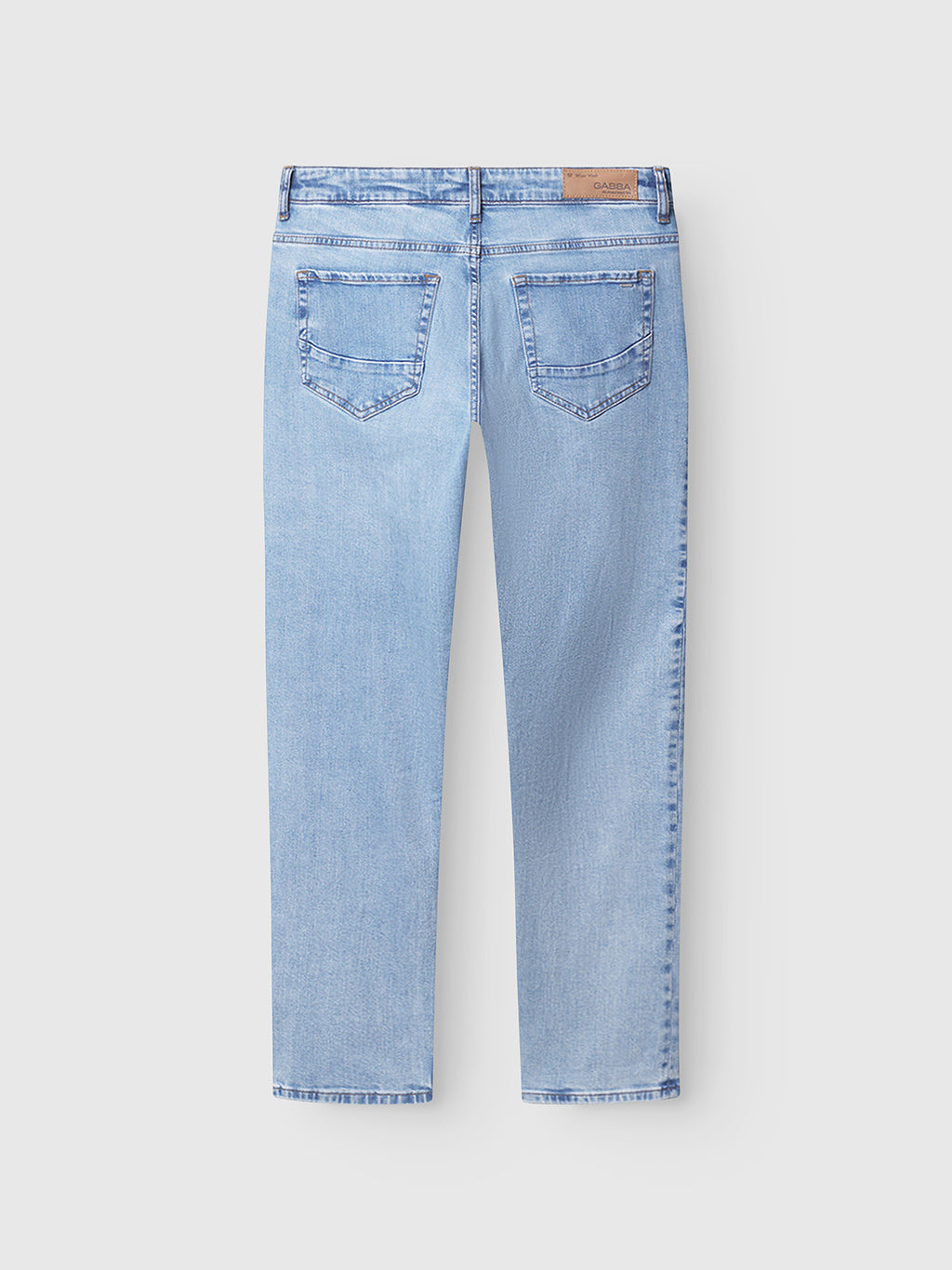 Back view of Gabba GABmarc F1012 - Lt. Blue Denim jeans in classic fit with straight legs, two back pockets, belt loops, and a brown leather patch on the waistband, laid flat on a white background.
