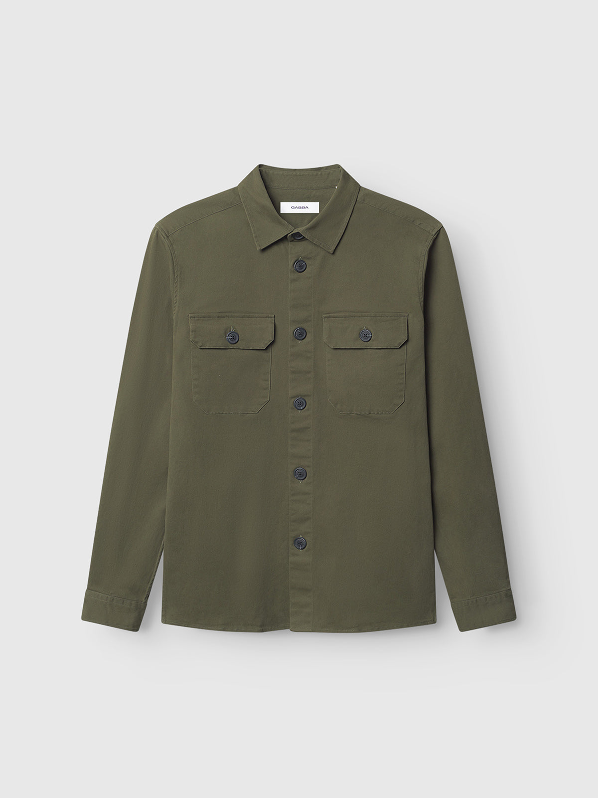 The GABBA GABtopper LS Shirt - Army is a regular-fit, olive green button-up overshirt featuring long sleeves, a classic collar, and two chest pockets. Crafted from heavyweight fabric for optimal layering, it’s shown here against a plain white background.