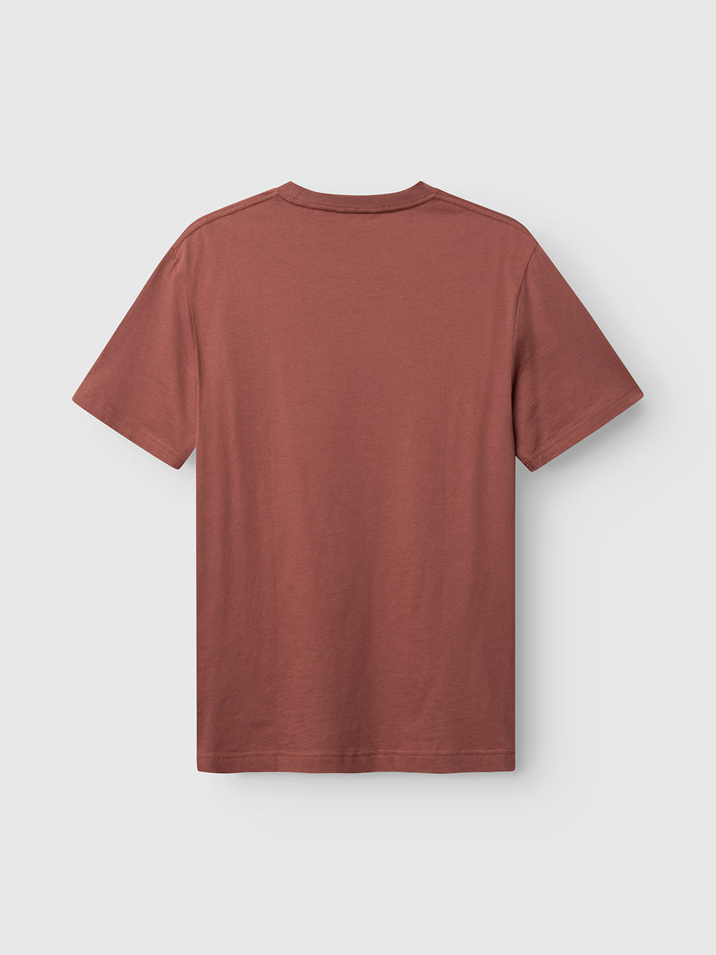 The Gabba GABdune Logo GOTS SS T-Shirt in Brick Red, made from organic cotton, is displayed laid flat with the back facing up against a light gray background.