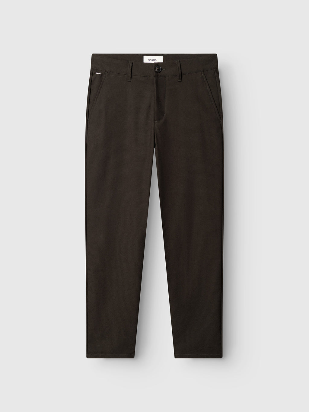 A pair of Gabba GABpaul Deme Pant - Forest Night slim chino fit, straight-leg trousers with side pockets, belt loops, and a button and zipper closure, crafted from a micro-pattern woven fabric and laid flat on a white background.