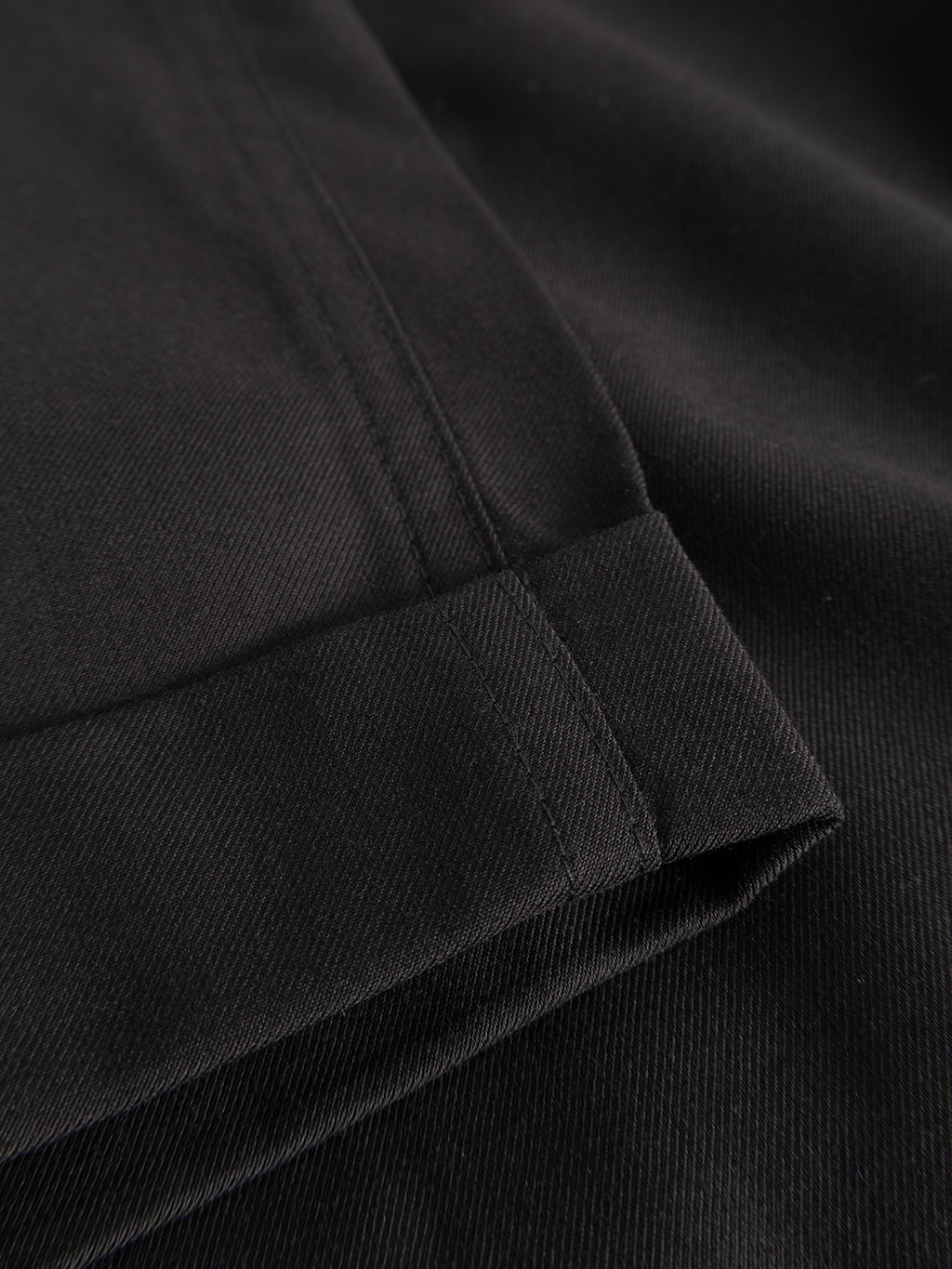 Close-up of the hem and stitching on Gabba's GABjoe Turnup Fin Pant in black, showcasing the twill fabric's texture and clean finish.