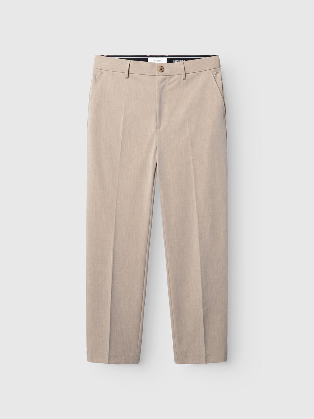 The Gabba GABjoe Tailor Dressy Pant in sand features belt loops, button and zip closure, side pockets, and a straight-leg fit, showcasing sleek chino style against a white background.