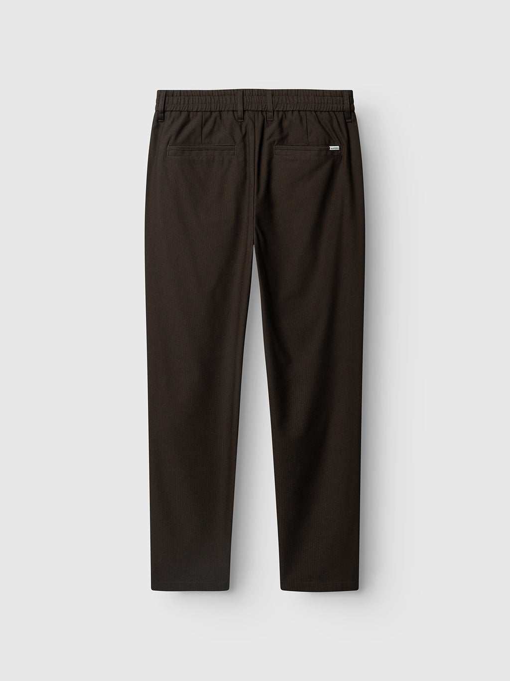 The Gabba GABmonza Tasca Deme Pant in Brown Slate features a relaxed straight fit with an elastic waistband, straight legs, and two back pockets, shown laid flat against a light gray background.