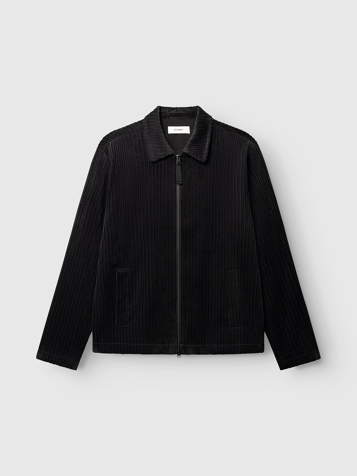 Gabba GABnik Zip Riglia GOTS Jacket in dark grey, featuring a wide-wale corduroy texture, collar, front zipper closure, and two side pockets, displayed against a plain light gray background.