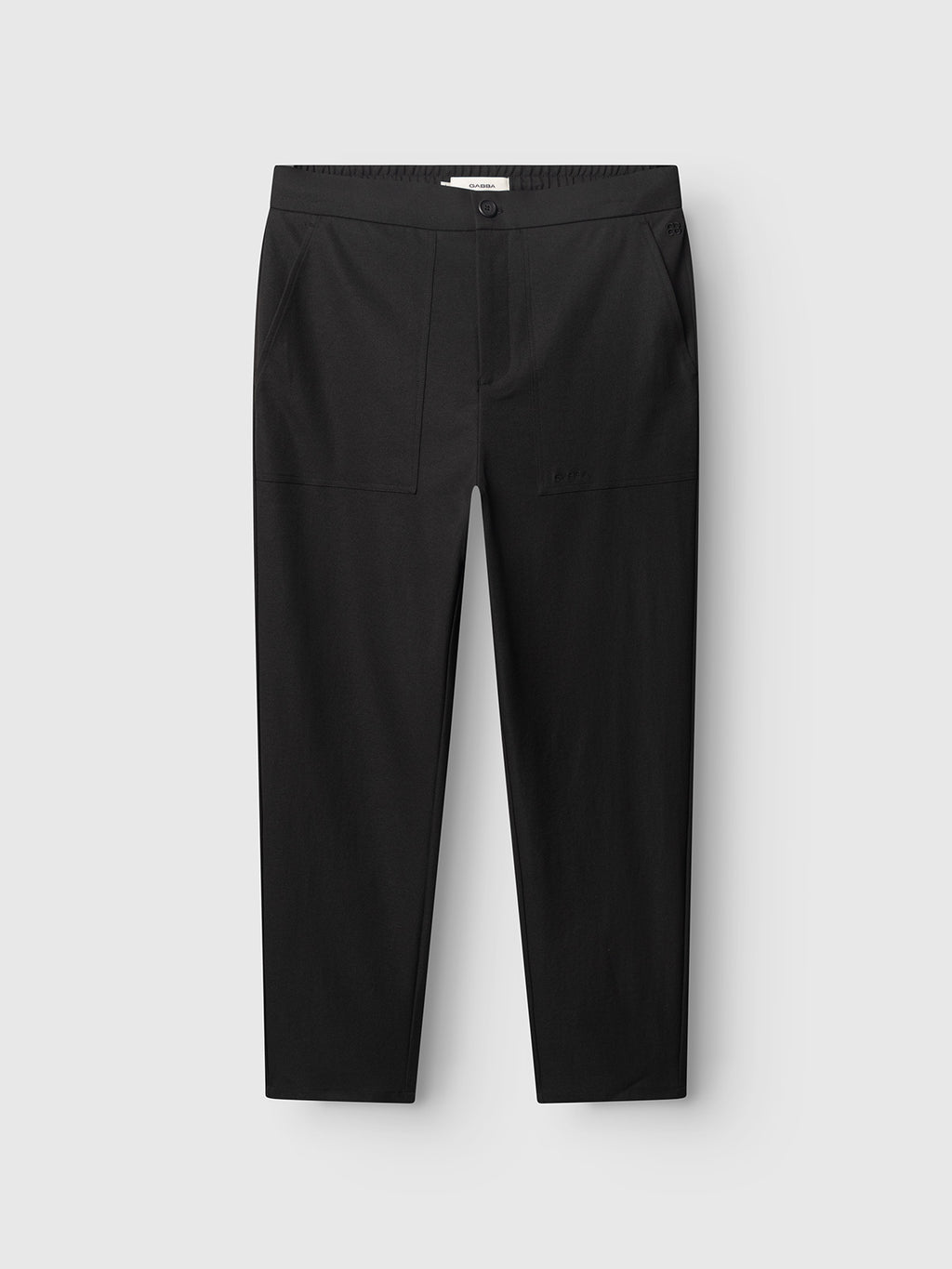 The Gabba GABzeta Nord Work Pant in Meteorite features a straight leg cut, front pockets, and a button closure. Made from lightweight technical twill, these workwear-inspired black pants are displayed laid flat against a light gray background.