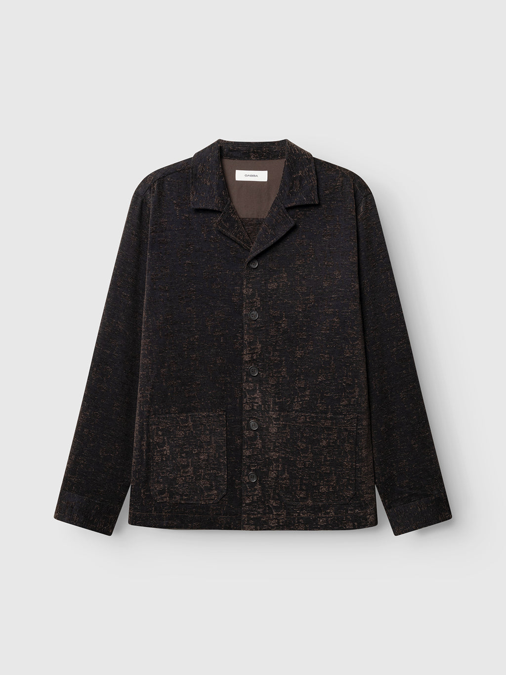 The Gabba GABsimone Pockt Monte LS Overshirt in Brown Slate is a dark, textured lyocell-blend jacquard button-up jacket with a collar and two front pockets, shown against a plain light gray background.