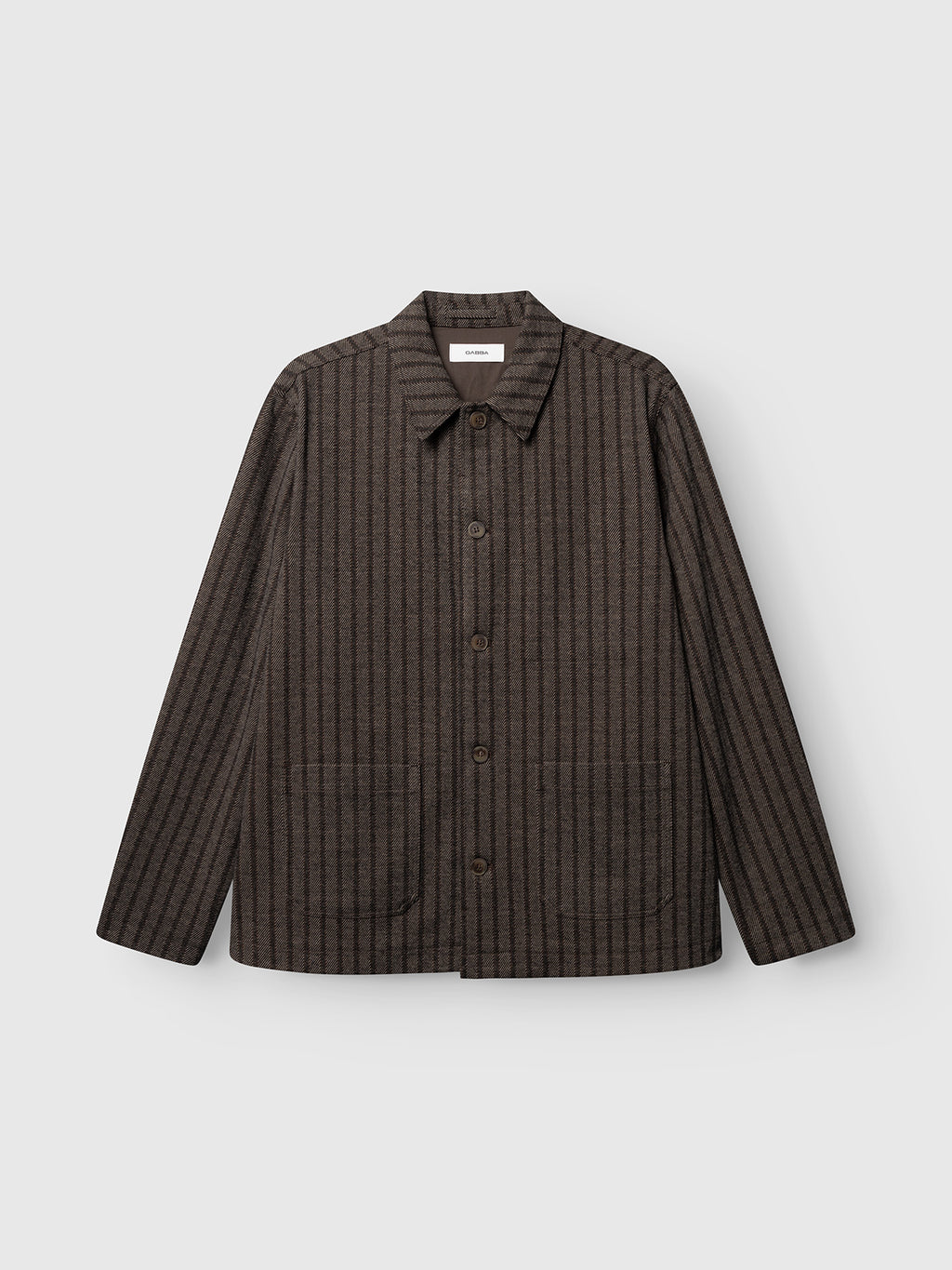 The Gabba GABlibre AX Zapies LS Overshirt in Brown Slate features brown and black stripes, a collared button-up design, and two front pockets—shown against a plain light gray background. This regular fit overshirt from Gabba is perfect for lightweight layering.